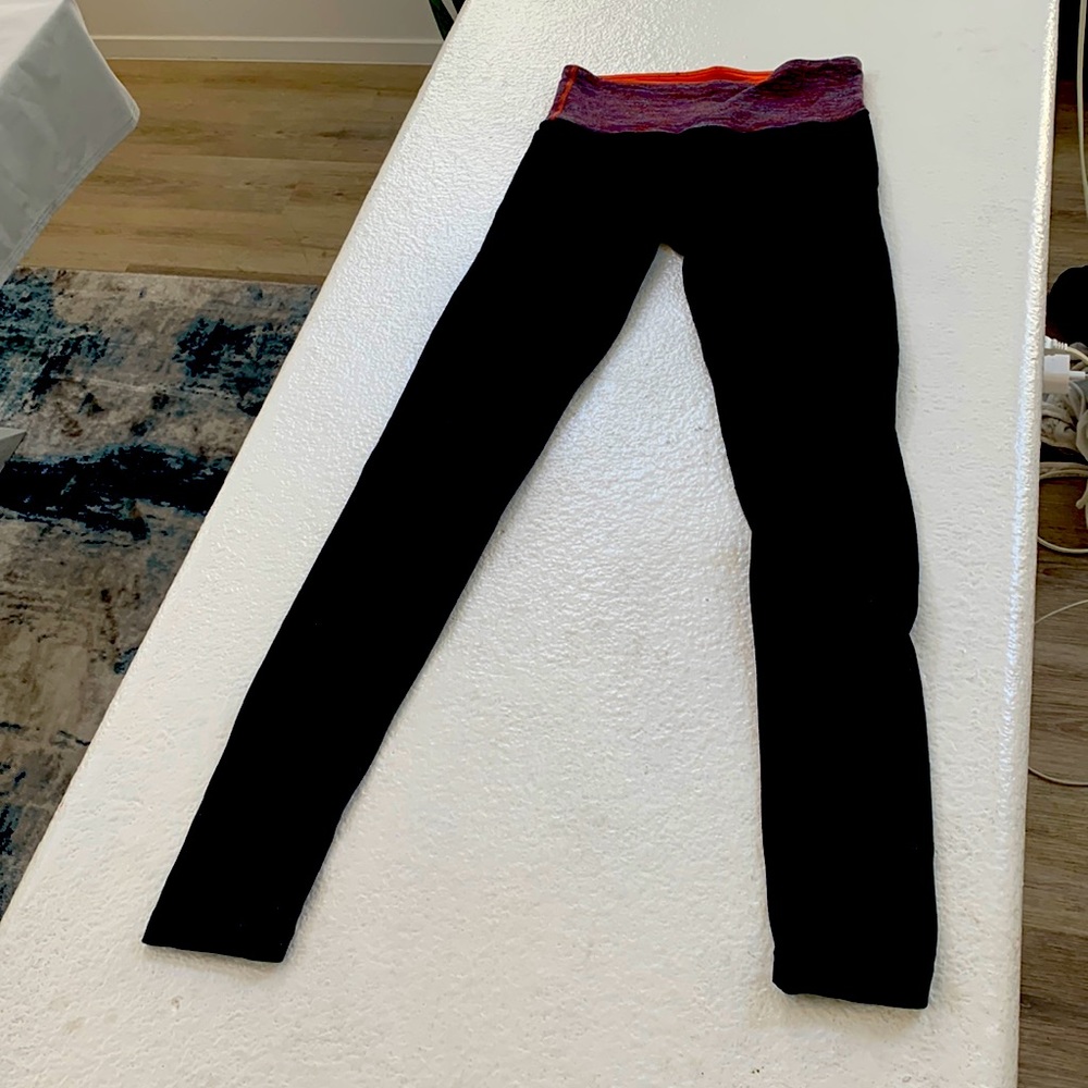 Lululemon Black Leggings with Multicolor striped and reversible Orange Waistband